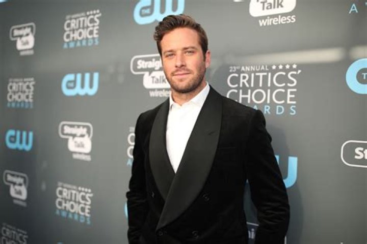 Armie Hammer's new girlfriend is 'standing by him' as he extends rehab stay amid police investigation over rape claim