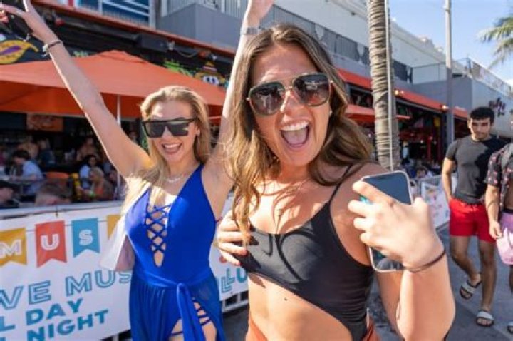 Boozed-up revellers go wild as bikini-clad students pack out beaches for Spring Break parties