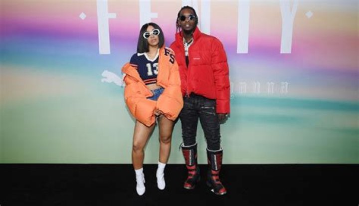 Cardi B flashes her cleavage in plunging pearl-studded string dress and continues to wear wedding ring amid Offset split