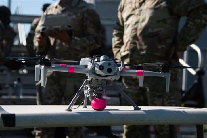 Chilling moment Mexico's deadliest cartel drops bombs from a DRONE onto rival camp in new turf war