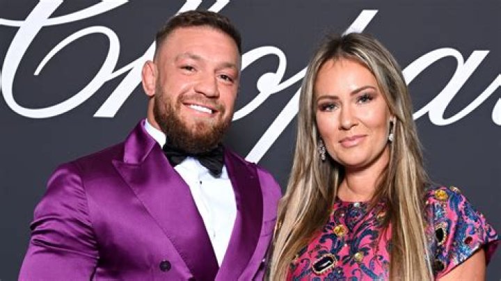 Conor McGregor looks huge in tight daring purple satin suit as UFC star heads to Cannes Film Festival with fiancee Dee