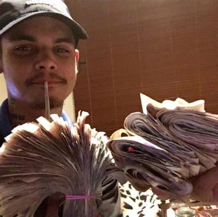 Drug dealers nailed by their phone pics as they pose with crossbow, huge sword and wads of cash after turf war attack – The US Sun