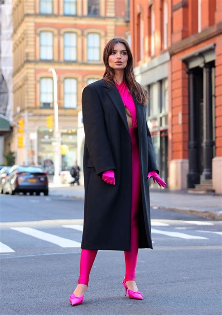 Emily Ratajkowski rocks hot pink crop top and matching skintight leggings as she films makeup ad on NYC street