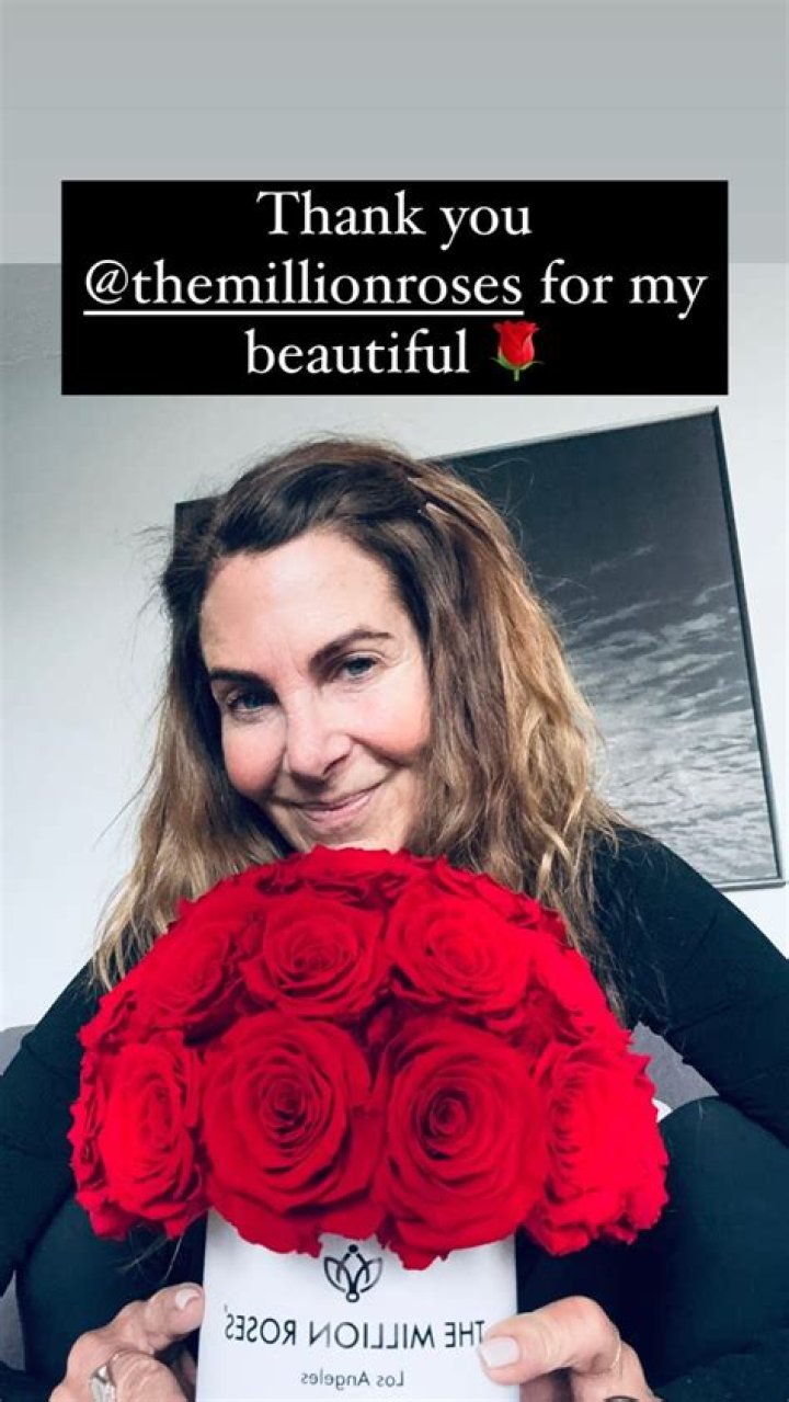 Golden Bachelor finalist Leslie Fhima shows off bouquet of roses after she's spotted cuddling A-list rapper