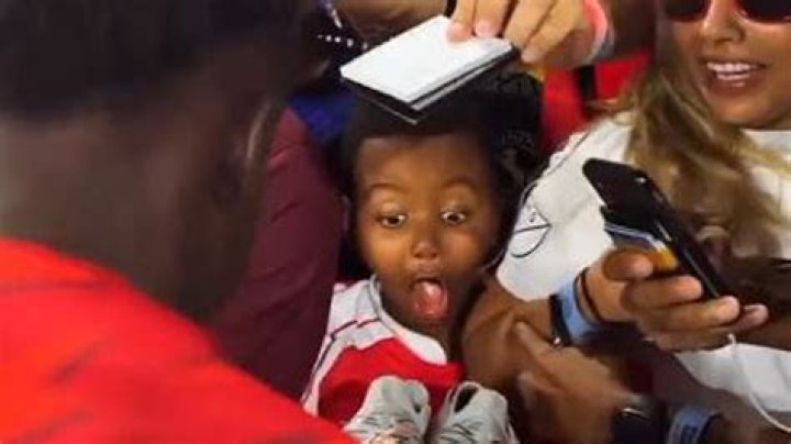 Heartwarming moment young Arsenal fan is left in shock after Bukayo Saka gives him his boots