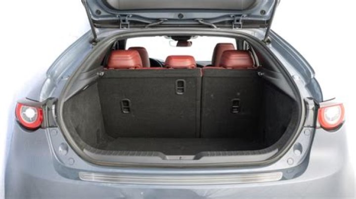 How do I manually open my Mazda 3 trunk?