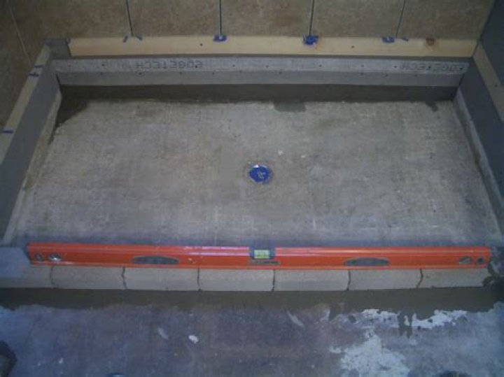 Quick Answer: How To Install A Shower Pan On Concrete Floor