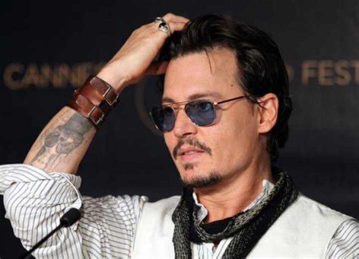 How many tattoos does Johnny Depp have?
