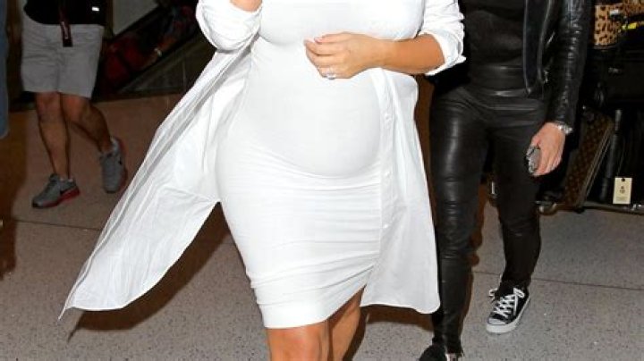 Kim Kardashian Glows in Tight White Dress: See Her Pregnancy Uniform