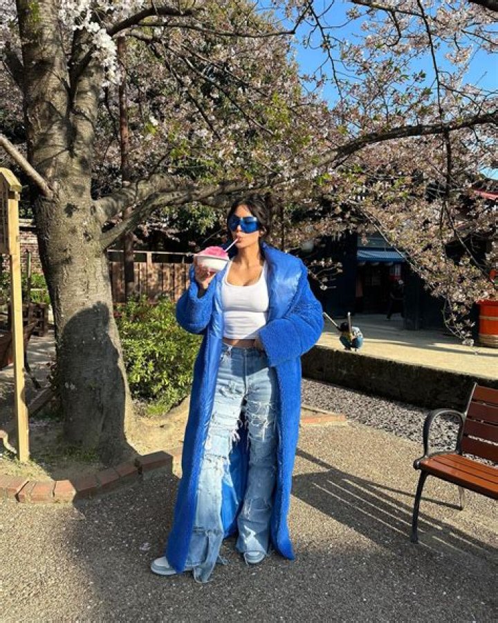 Kim Kardashian's ultra-thin frame drowns in baggy jeans as star shares new photos from Japan getaway
