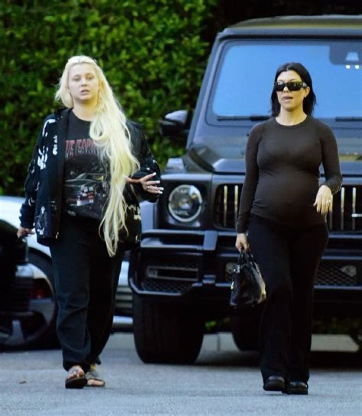 Kourtney Kardashian shows off her huge baby bump with stepdaughter Alabama Barker, 17, in rare outing in LA