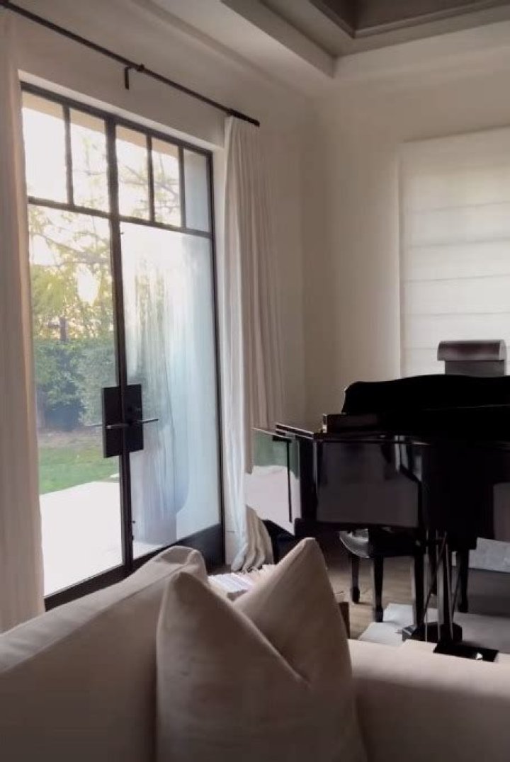 Kourtney Kardashian shows off lavish living room in $9M LA mansion with grand piano, fireplace, and sunset views