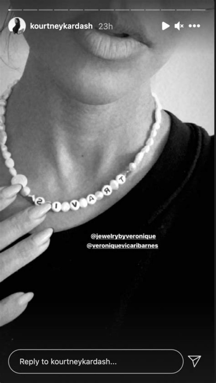 Kourtney Kardashian and boyfriend Travis Barker show off matching name necklaces as fans are convinced she's pregnant