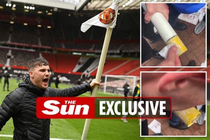 Man Utd protester snorts white powder off stolen Old Trafford corner flag after invading pitch