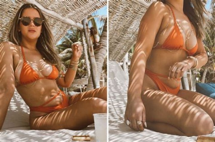 Maren Morris poses in a tiny bikini after boasting she is 'proud' of her body one year after giving birth to son Hayes