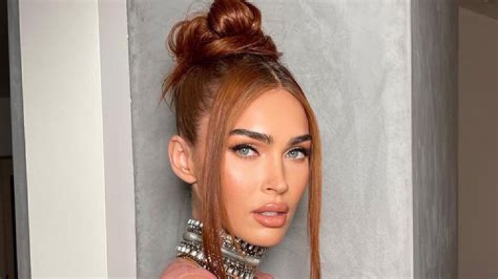 Megan Fox flaunts her curves as she goes braless in see-through orange dress for very sexy new pics