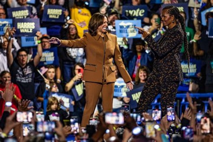 Michelle Obama ‘booty slaps’ twerking male dancer’s bum while partying at wild concert – The US Sun