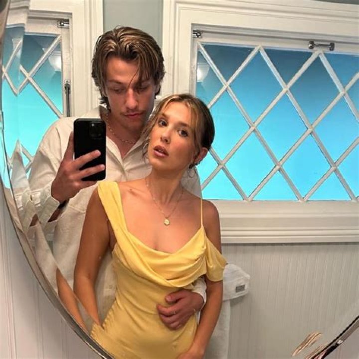 Millie Bobby Brown Kisses Husband Jake Bongiovi in Photo Booth