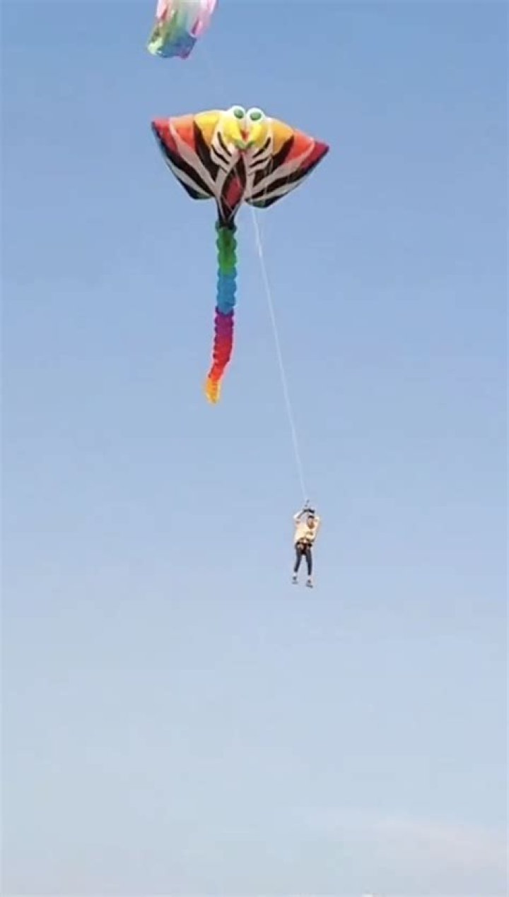 Heart-stopping moment girl, 3, is whipped more than 100ft into air by giant kite