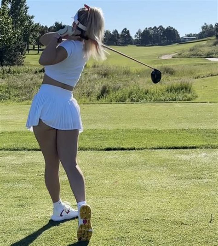 Paige Spiranac almost bursts out of golf top as she offers to help fans ‘with their shaft’ in VERY cheeky video