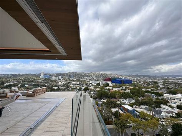 Inside Phil Neville’s flash penthouse as it FINALLY sells 13 years after going on the market - with price slashed by £2m