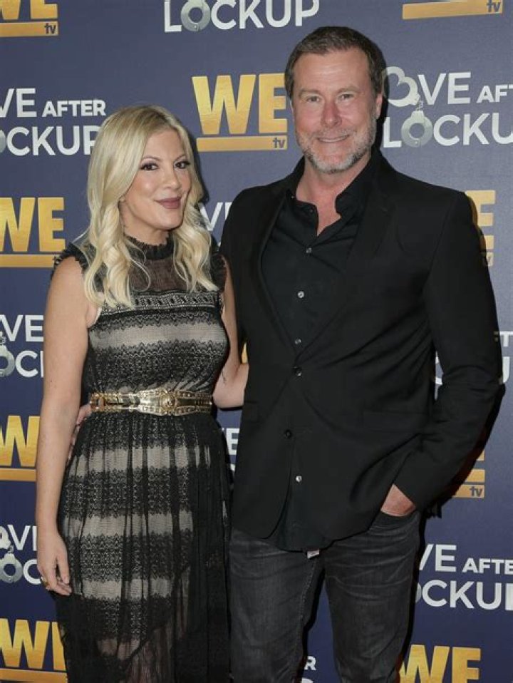Tori Spelling dresses up as a dead bride & shows off major cleavage as fans believe star has split from Dean McDermott