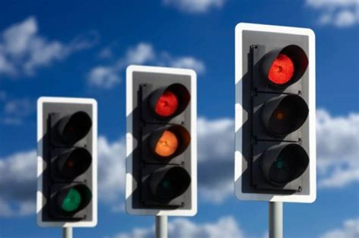 Traffic lights could get a FOURTH colour 'to save drivers money & time' in AI-powered plans to future-proof roads
