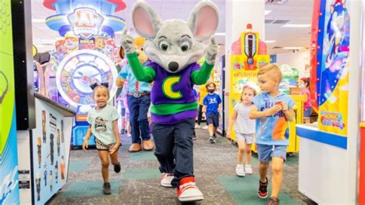 What do Chuck E Cheese employees wear?
