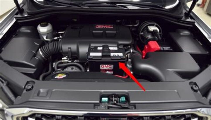 Where is the battery located in a 2013 Dodge Avenger?