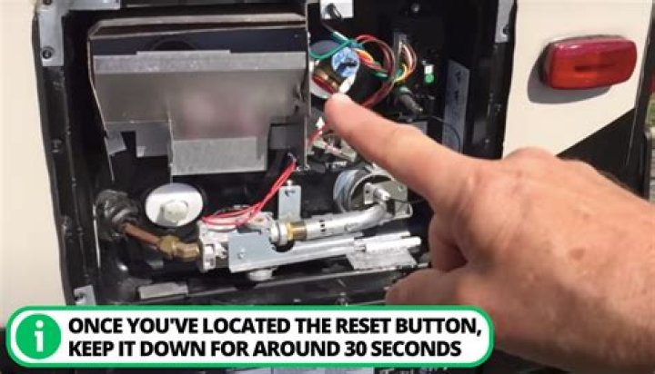 Where is the reset button on my Whirlpool water heater?